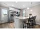 Kitchen with white cabinets, stainless steel appliances, and granite countertops with bar seating at 3722 Windy Pine Nw Ln, Hickory, NC 28601