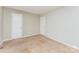 Bedroom with carpeted floor features two doors and multiple electrical outlets, offering a comfortable and adaptable space at 3941 Briarhill Dr, Charlotte, NC 28215