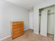 This cozy bedroom has neutral paint, carpet and a spacious closet at 3941 Briarhill Dr, Charlotte, NC 28215
