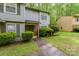 Charming two-story townhome featuring tidy landscaping and a welcoming entrance at 3941 Briarhill Dr, Charlotte, NC 28215