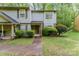 Charming two-story townhome featuring tidy landscaping and a welcoming entrance at 3941 Briarhill Dr, Charlotte, NC 28215