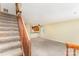 Bright living space with carpet, staircase, ceiling fan, and a view of the kitchen at 3941 Briarhill Dr, Charlotte, NC 28215