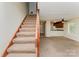 Inviting living area with stairs to the second floor and a glimpse of the kitchen at 3941 Briarhill Dr, Charlotte, NC 28215