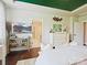Sunlit bedroom featuring a decorative ceiling, dresser, and wooden accents at 423 Sensibility Cir, Fort Mill, SC 29708