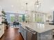 Bright, modern kitchen with an island, stainless steel appliances, and open layout to the dining area at 423 Sensibility Cir, Fort Mill, SC 29708