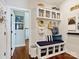 Inviting mudroom with built-in bench, storage cubbies, and stylish decor at 423 Sensibility Cir, Fort Mill, SC 29708