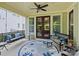 Inviting porch with ceiling fan, swing, and outdoor seating area at 423 Sensibility Cir, Fort Mill, SC 29708