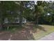 Modest single-story home nestled among mature trees, needs some TLC at 433 E Geroid St, Salisbury, NC 28144