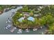 Aerial view of community amenities featuring a pool, tennis courts, boat docks, and lake access at 4525 Island Waters Dr, Denver, NC 28037