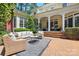 Beautiful backyard with a patio area, outdoor furniture, and well-maintained landscaping at 4525 Island Waters Dr, Denver, NC 28037