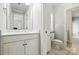 Bright bathroom with tiled floor, white vanity, and a combination tub and shower at 4525 Island Waters Dr, Denver, NC 28037