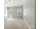 Bright, spacious bedroom with neutral carpet, fresh paint, and a large window for natural light at 4525 Island Waters Dr, Denver, NC 28037