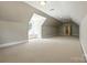 Expansive bonus room with ample natural light and neutral carpet provides a versatile space at 4525 Island Waters Dr, Denver, NC 28037