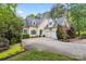 Inviting two-story home with a three-car garage, lush landscaping, and a well-maintained lawn at 4525 Island Waters Dr, Denver, NC 28037