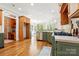 Bright kitchen with green cabinets, stainless steel appliances, and an open layout at 4525 Island Waters Dr, Denver, NC 28037