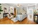 Comfortable living room with a fireplace, built-in shelving, and hardwood floors at 4525 Island Waters Dr, Denver, NC 28037