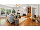 Cozy living room featuring a fireplace, hardwood floors, and lots of natural light at 4525 Island Waters Dr, Denver, NC 28037