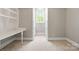 Bright office featuring built-in shelving, a desk, and a large arched window at 4525 Island Waters Dr, Denver, NC 28037