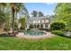 An inviting backyard featuring a refreshing pool and patio surrounded by lush landscaping at 4525 Island Waters Dr, Denver, NC 28037