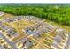 Aerial view of a neighborhood with lush green trees, a playground, and well-manicured lawns at 5014 Fandango Rd, York, SC 29745