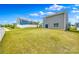 Spacious backyard with well-maintained lawn, white fence, and back exterior of house at 5014 Fandango Rd, York, SC 29745