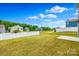 Well-maintained backyard surrounded by a white picket fence, offering space and scenery at 5014 Fandango Rd, York, SC 29745