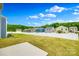 Backyard featuring a well-maintained lawn surrounded by a white picket fence and some trees at 5014 Fandango Rd, York, SC 29745