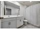 Bathroom featuring a double sink vanity, mirror, toilet, and shower at 5014 Fandango Rd, York, SC 29745