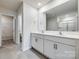 Bright bathroom features a double vanity with white cabinetry and a large mirror at 5014 Fandango Rd, York, SC 29745