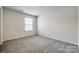 A bright bedroom is carpeted and features a window with blinds for natural light at 5014 Fandango Rd, York, SC 29745