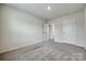 Neutral bedroom showcasing carpet floors and three doorways for versatile access at 5014 Fandango Rd, York, SC 29745