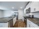 Modern kitchen features white cabinets, stainless steel appliances, and granite countertops at 5014 Fandango Rd, York, SC 29745