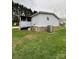 Features of a single-story home including the yard and exterior systems at 51 Kings Dr, Taylorsville, NC 28681