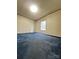 Spacious bedroom featuring a window, blue carpet, and ample natural light at 51 Kings Dr, Taylorsville, NC 28681