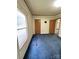 Bedroom featuring two doors, a window and blue carpet at 51 Kings Dr, Taylorsville, NC 28681