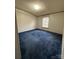 Bedroom showcasing a window and blue carpet at 51 Kings Dr, Taylorsville, NC 28681