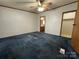 Well-sized bedroom with ceiling fan, doorway to closet, and view of connected bathroom at 51 Kings Dr, Taylorsville, NC 28681