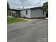 Charming single-story home with a covered porch and paved driveway at 51 Kings Dr, Taylorsville, NC 28681