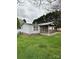 A well-kept home featuring vinyl siding and a covered porch on a green lawn at 51 Kings Dr, Taylorsville, NC 28681