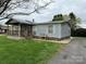 Charming single-story home with a covered porch and well-maintained lawn at 51 Kings Dr, Taylorsville, NC 28681