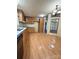 Charming kitchen features wood cabinets, laminate floors, and plentiful counter space at 51 Kings Dr, Taylorsville, NC 28681