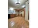 Cozy kitchen with wood cabinetry, laminate floors, and functional layout at 51 Kings Dr, Taylorsville, NC 28681