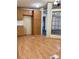 Traditional kitchen with wood cabinets, laminate floors, and adjacent dining area at 51 Kings Dr, Taylorsville, NC 28681