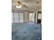 Inviting living room features large sliding glass doors and entry to front door at 51 Kings Dr, Taylorsville, NC 28681