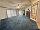 Open living room featuring a fireplace, neutral walls and carpet flooring at 51 Kings Dr, Taylorsville, NC 28681