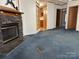 Cozy living room showcasing a stone fireplace and carpeted floors at 51 Kings Dr, Taylorsville, NC 28681