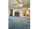 Open living room with a stone fireplace and access to other rooms at 51 Kings Dr, Taylorsville, NC 28681