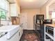 This modern kitchen is equipped with stainless appliances, granite countertops, and black hardware at 557 Wakefield Dr # A, Charlotte, NC 28209
