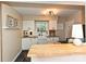 Modern kitchen features white cabinets, granite countertops, and undermount sink at 557 Wakefield Dr # A, Charlotte, NC 28209