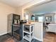 Cozy kitchen featuring stainless steel appliances, dark floors, and an inviting opening to the living room at 557 Wakefield Dr # A, Charlotte, NC 28209